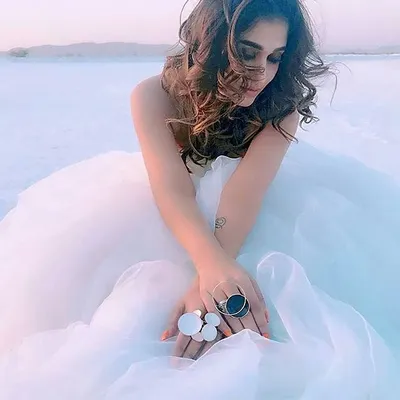 This is a shot of the custom white infinity gown I designed for the incredible Nayanthara. She wore this piece for a song sequence in the movie 'Vellaikaran', and it was a dream to see my creation become part of her angelic look.