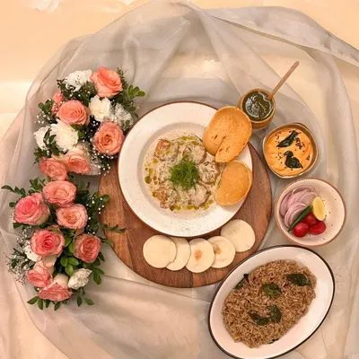 This is how I serve my Green Chili Malai Prawns as a complete meal. The main dish is accompanied by a flavorful pulao, fresh salad, and a selection of dips and chutneys to create a balanced and fulfilling platter.