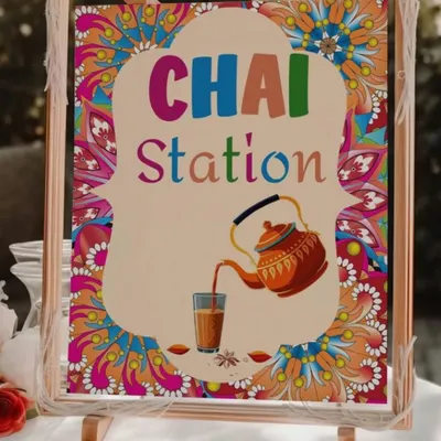 A vibrant and colorful sign for a 'Chai Station' at a Sagan ceremony. This is a perfect addition to a high-tea setup or a festive Indian event, welcoming guests to enjoy a warm cup of tea.
