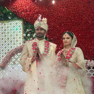 Arihant and Jagriti share a moment of joy during their wedding ceremony. Surrounded by a shower of petals, their union symbolizes the beautiful outcome when two hearts dedicated to seva and knowledge come together.