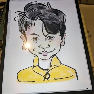 A look at a digital caricature portrait being drawn on a tablet. This medium combines traditional drawing skills with modern technology.