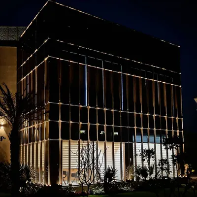 The full facade of a commercial office block in Zirakpur, where I used integrated linear lighting to emphasize its modern, glass-paneled structure. The lighting gives the building a professional and high-tech identity.