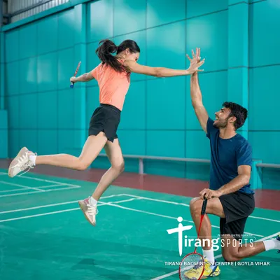This high-five in mid-air captures the energy and joy we see on our courts every day. This professional shot was taken at our Goyla Vihar center for a Canva photoshoot, showcasing our world-class facility.