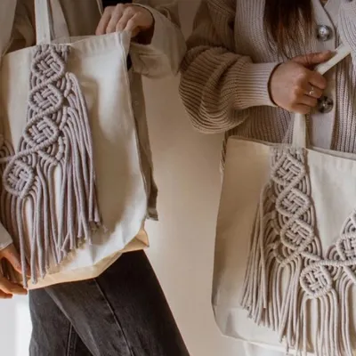 My eco-friendly tote bags are perfect for when you need a little extra space. I take a simple cotton tote and add my own unique macrame designs, like this "DNA wala" pattern, to make it special.