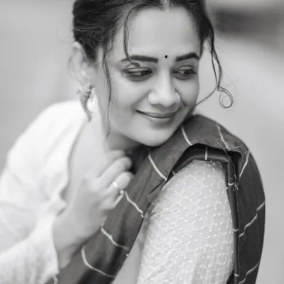 A classic black and white portrait of Spruha Varad, capturing a moment of quiet elegance during our purple saree series shoot.