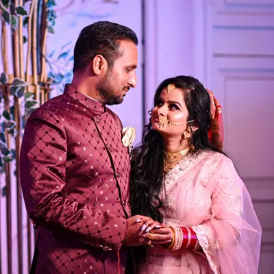 A candid moment between the couple during their reception. It's these unposed, loving glances that truly tell the story of the day, captured in a natural and authentic way.
