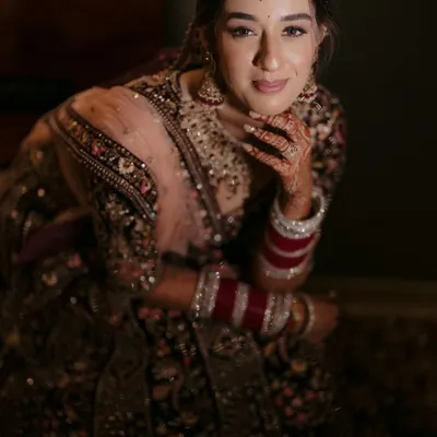 A stunning close-up portrait of the bride, her gentle smile and beautiful makeup creating a look of pure elegance.