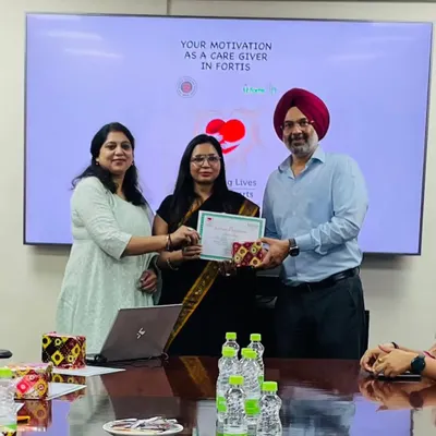 Receiving a certificate of appreciation for a session on caregiver motivation at Fortis. It's a reminder of the positive impact we can have on those who care for others.