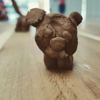 A charming little bear, sculpted with care by one of our young artists. Even simple forms can be full of personality and character.