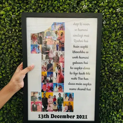 We love adding all your memories into a single frame. This custom piece celebrates a first anniversary with a photo collage shaped like the number '1', a personal quote, and the wedding date, all in a sleek black frame.