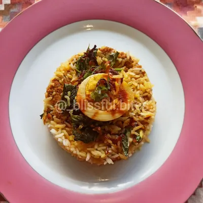 I created this Mince Chicken Biryani as a delicious alternative to the classic version. Fragrant rice is layered with spiced chicken mince and fresh herbs, then garnished with a boiled egg. It's a flavorful one-pot meal.