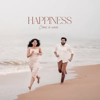 Happiness truly comes in waves. This image captures a moment of pure, unscripted joy as the couple runs along the Honnavara shoreline, their laughter echoing the sound of the sea.