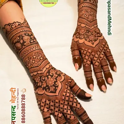 An elegant Indo-Arabic design that flows from the forearm to the fingers. The combination of delicate floral work and bold, vine-like patterns creates a very graceful look.