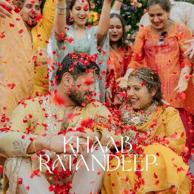 A perfect Haldi shot, with the couple surrounded by loved ones under a shower of rose petals. This is the kind of joyful, chaotic moment I love to capture.