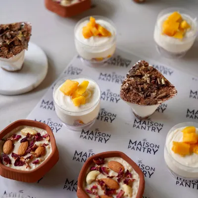 A selection of my individual desserts, perfect for a flying buffet at a Diwali party. This image shows Mango Mousse, Tiramisu, and Phirni, offering something for every sweet tooth.