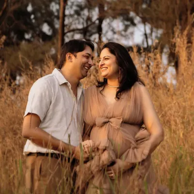 The best photos come from genuine smiles. I prompted this couple to share a quiet joke, and the result was this beautiful, unscripted moment of laughter during their golden hour maternity shoot.