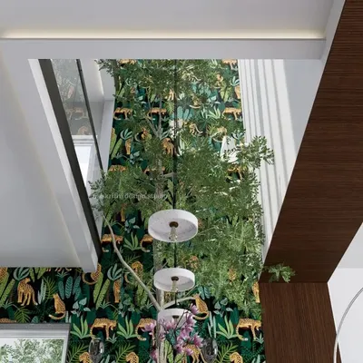 This was our proposed concept for the 'Tranquil' project, featuring a fully grown tree in a central double-height courtyard. Paired with a bold, dark luxury wallpaper and hanging lights, this design redefines the idea of an indoor courtyard as a dramatic focal point.