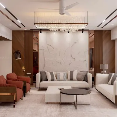 A wide view of a modern luxury living room, showcasing a balanced composition of sleek white sofas, terracotta accent chairs, and a stunning textured marble feature wall. The recessed ceiling with rose gold trim adds a layer of sophistication.