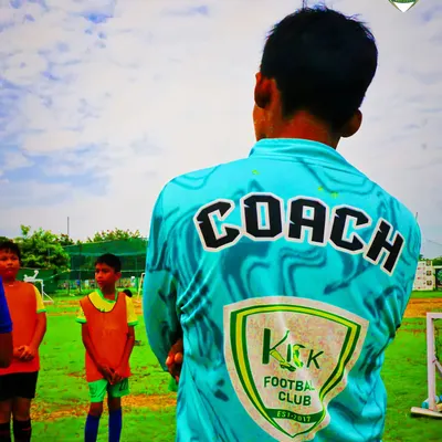 The back of a coach's jersey says it all. Our coaches lead by example, embodying the club's values of learning, expression, growth, and achievement.