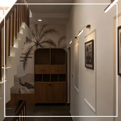 A view of the reimagined transition space at the Bangalore Club. We used a striking wall mural, warm wood storage, and focused lighting to transform this hallway into a memorable part of the health club experience.