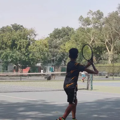A young player prepares to hit a forehand during the TPL-ITA Tennis Tournament held at our academy. Competitive events like these are a crucial part of our program, allowing players to test their skills and gain valuable match experience.
