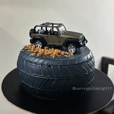 This cake was a special request for my brother's birthday. It's designed to look like a rugged jeep tire, complete with cookie crumble "dirt" and a toy jeep on top.
