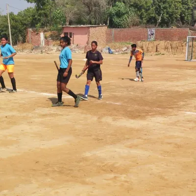We train our players to be versatile on any surface. Here, my sub-junior girls are in action during trials on a traditional dirt ground, showcasing their fundamental skills.