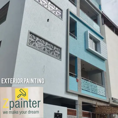 A complete exterior painting project for a multi-story residence. We used a combination of textured white and smooth blue paint to create a modern, clean facade that stands out.