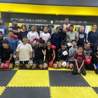 We don’t just train to fight, we train to conquer every fear, doubt, and limit. Our diverse family of fighters, all geared up and ready to grind.