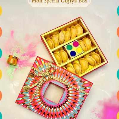 Sweeten your Holi with our special Gujiya box. The vibrant, kaleidoscopic packaging opens to reveal delicious, freshly made gujiyas and a palette of herbal colors, making it a perfect festive treat.