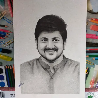 This is the final version of a commissioned individual portrait, completed on A3 paper. The background is filled with my art supplies, showing the tools I use to create these detailed graphite sketches.