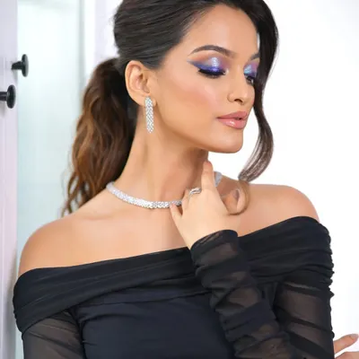 Eyes that speak louder than words. This bold, fierce, and unapologetically glam look features a stunning blue and purple smokey eye, perfect for a cocktail party or a night out.