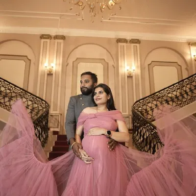 A fairytale moment. This flowing pink tulle gown is perfect for capturing the magic of your maternity journey. Available for rent.