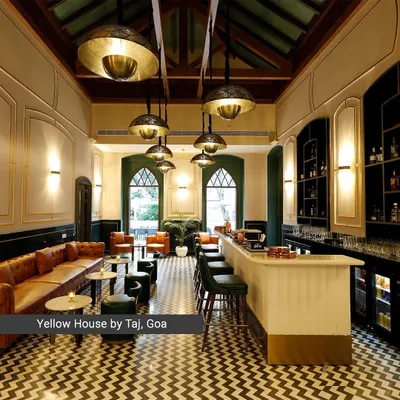 The bar at the Yellow House by Taj, Goa, is a study in heritage revival. I restored the Portuguese-inspired villa, blending a historic trussed roof and arched windows with a modern chevron-patterned floor and custom brass lighting to create a timeless atmosphere.