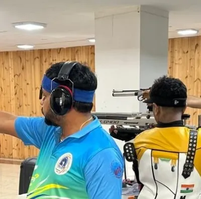 A close-up action shot of our pistol shooters during a training session. We offer professional coaching for all levels, from beginner experience sessions to advanced competitive training.