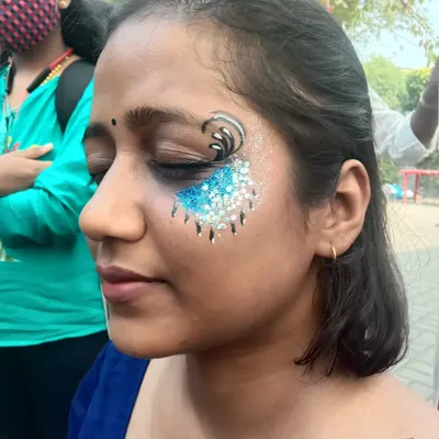 My signature dripping glitter effect. Here, I've combined a black swirl with a cascade of blue and silver glitter for a dramatic, eye-catching look.