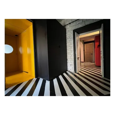 The interior of our CoLive @ TAS project, where we resurrected a dilapidated 1960s apartment. The design uses bold graphic flooring and color blocking to create a dynamic living space for the architects of our studio.