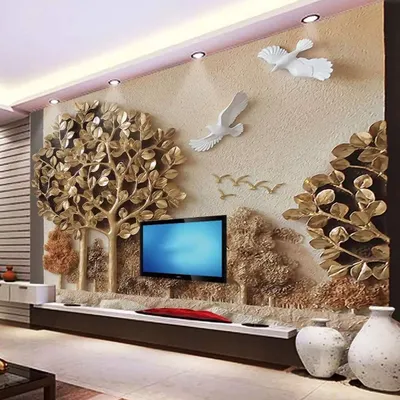 This 3D wallpaper featuring a golden tree of life is a perfect example of a high-impact feature wall. The raised, metallic elements catch the light beautifully, creating a luxurious and artistic focal point for a living room or entryway.