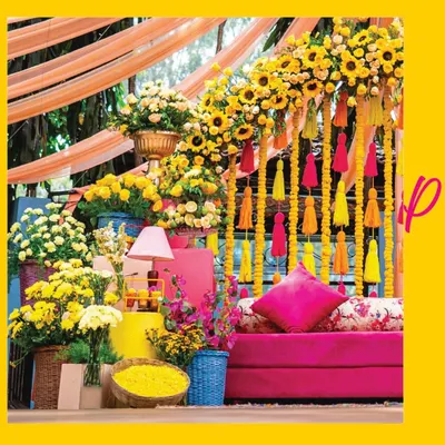 Mehendi ceremonies are all about joy and color. For this celebration, I designed a vibrant setting with a comfortable pink settee, set against a backdrop of bright marigold garlands and playful tassels, creating the perfect atmosphere for fun and festivity.
