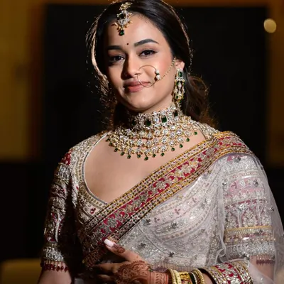 For this bride, we created a custom diamond and green stone choker that was as unique as her story. It is an honor to craft pieces that become part of such a significant day.