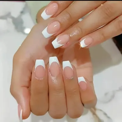 The perfect classic French manicure on long, coffin-shaped nails. The lines are crisp and the finish is glossy and flawless.