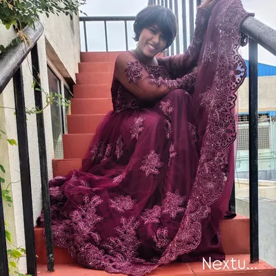 A shot from a photoshoot in this beautiful embroidered purple gown. I love the drama and elegance of this outfit, sitting on the stairs.