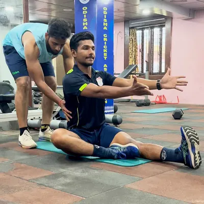 Here, I am assisting an athlete with a myofascial stretch. This technique helps to release tension in the connective tissue, improving mobility and reducing the risk of muscle strains.