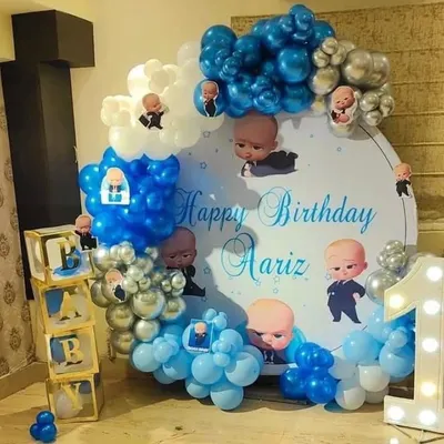 This Boss Baby theme is a complete package for a first birthday. It has a custom backdrop with the baby's name, a balloon arch, 'BABY' display boxes, and a large light-up '1'. It’s a great choice for a boy's birthday party.