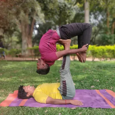 This is what faith looks like in AcroYoga. As the base, I'm supporting my partner in a deep backbend, a variation of Urdhva Dhanurasana. It requires stability from me and trust from him.