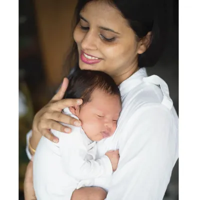 There is nothing more peaceful than a sleeping newborn nestled against their mother. My in-home newborn photography sessions in Delhi and Kolkata are designed to be stress-free, capturing the serene bond between you and your baby.