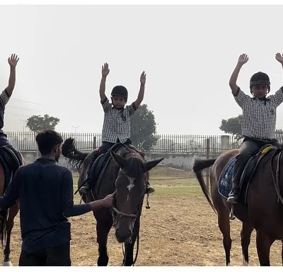 The joy of accomplishment is a shared experience. Our group sessions for young riders focus on fun, encouragement, and learning together in a supportive community.