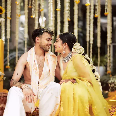 A quiet, loving gaze between the couple during their Haldi ceremony. These are the unscripted moments, filled with pure emotion, that I strive to create space for.