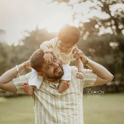 There is a special kind of magic in the bond between a father and his child. I love capturing these simple, joyful moments, like a piggyback ride in the golden afternoon light, that you will cherish forever as a timeless family memory.
