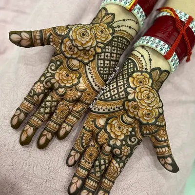 A beautiful example of modern floral henna. This design features bold, shaded roses on the palms with a delicate jaali pattern, leaving some open space for a contemporary feel.